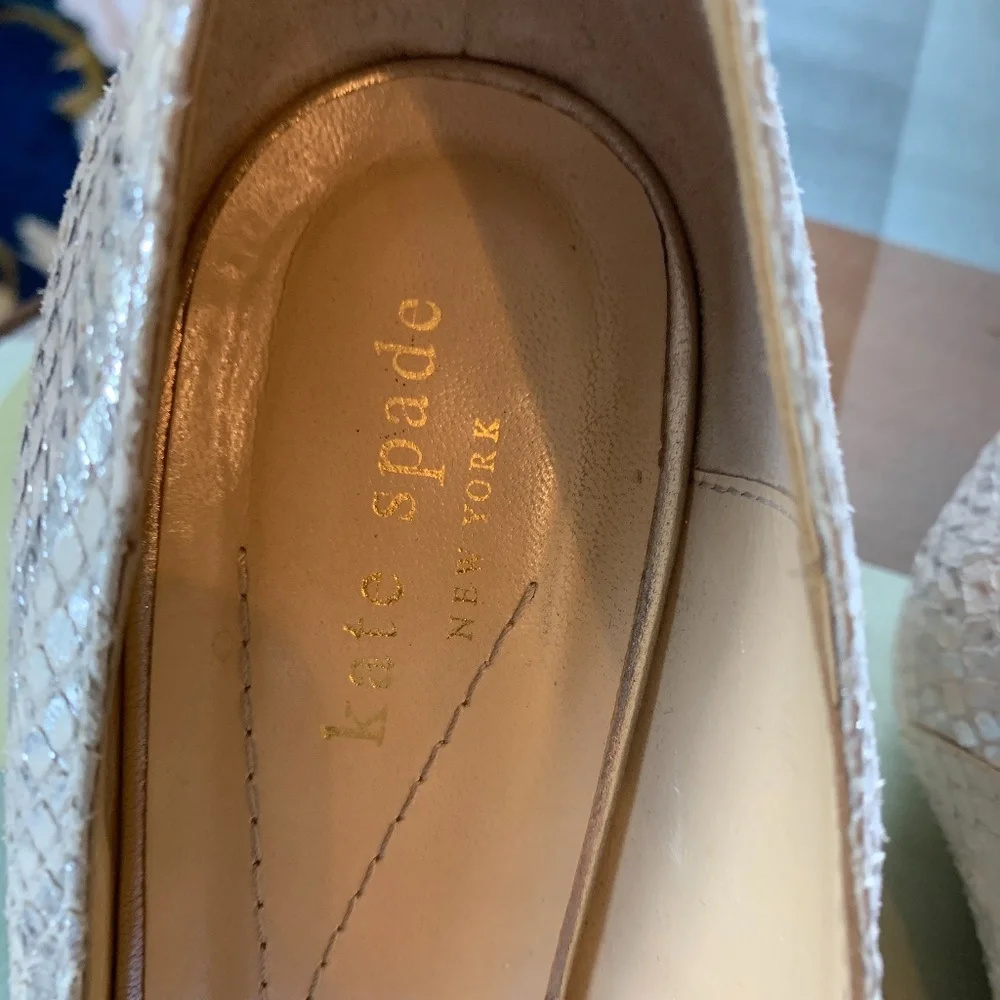 Kate soade silver bow shoes. Worn about 5 times. Mark’s on bottom but great conf
